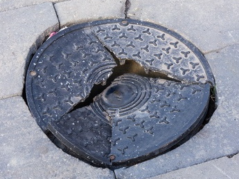 manhole-cover-damage